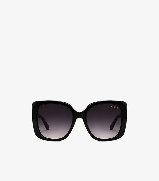Guess women's oversized square sunglasses with glossy frame and gradient UV protection lenses, front view.