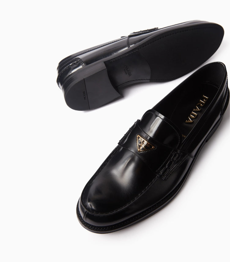 PRADA TRIANGLE LOGO LOAFERS IN BRUSHED LEATHER