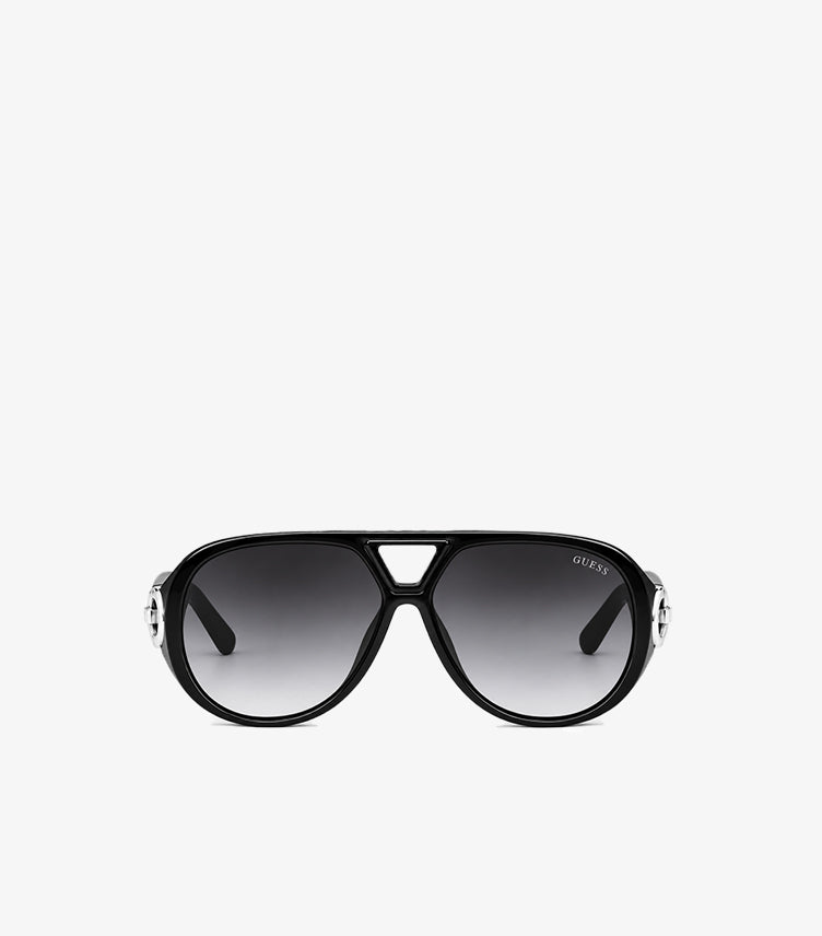 Front view of Guess women’s oversized black aviator sunglasses with grey gradient lenses and silver-tone G logo accents
