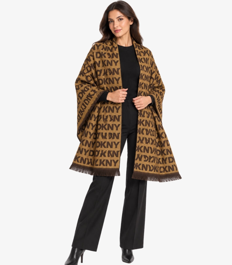 DKNY Women's Brown Monogram Shawl featuring all-over DKNY logo pattern and fringed edges, styled on a female model.