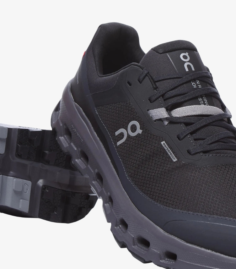 Close-up of On Running waterproof trail trainer showing technical upper, logo, laces and textured outsole