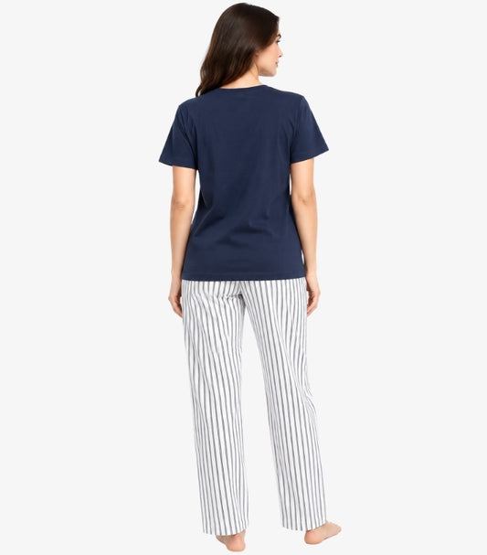 Back view of a model wearing a Marks & Spencer women’s short-sleeved pyjama top with striped straight-leg bottoms