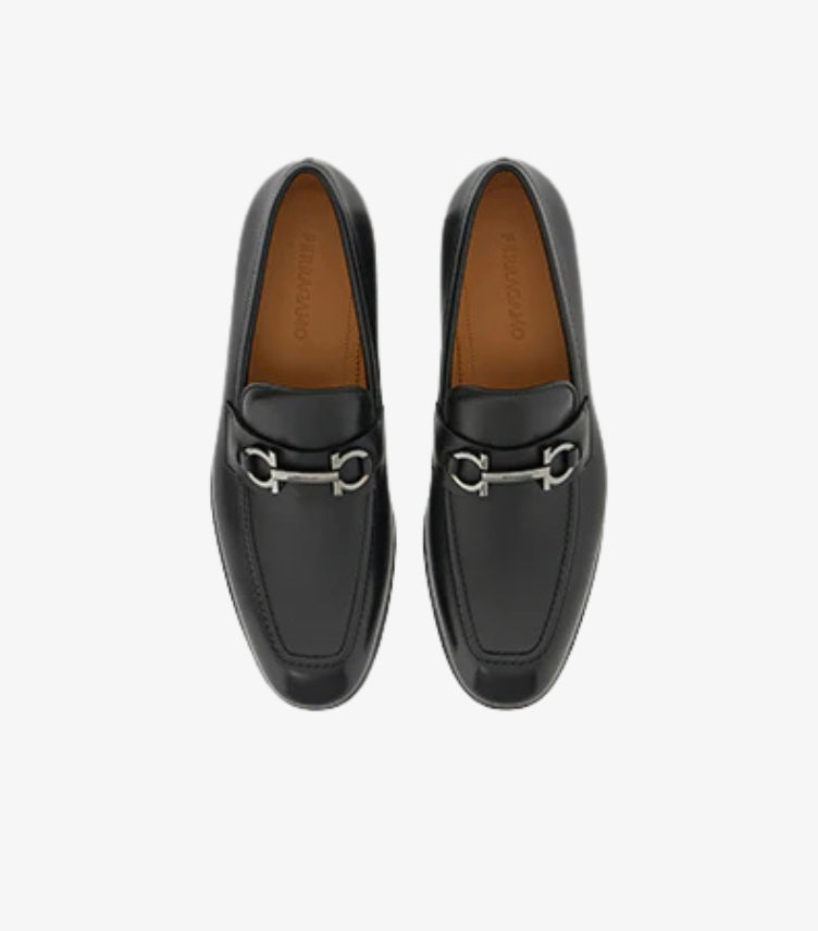 Ferragamo Gancini Bit loafers black leather top-down pair view showing silver Gancini hardware and tan lining