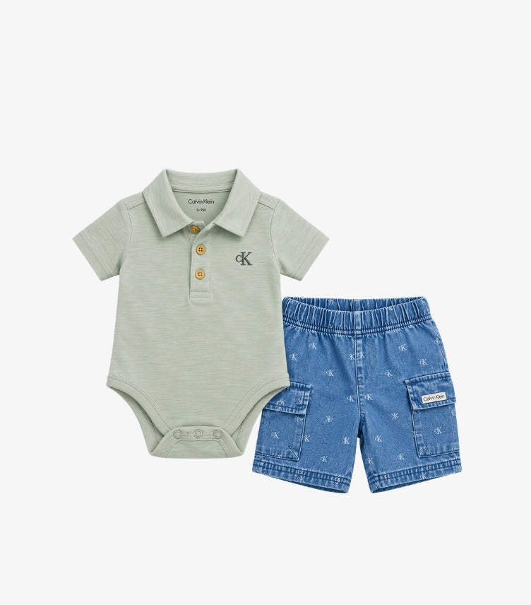 Calvin Klein baby boys 2-piece outfit featuring a sage green polo bodysuit with CK chest logo and blue denim cargo shorts with monogram print.