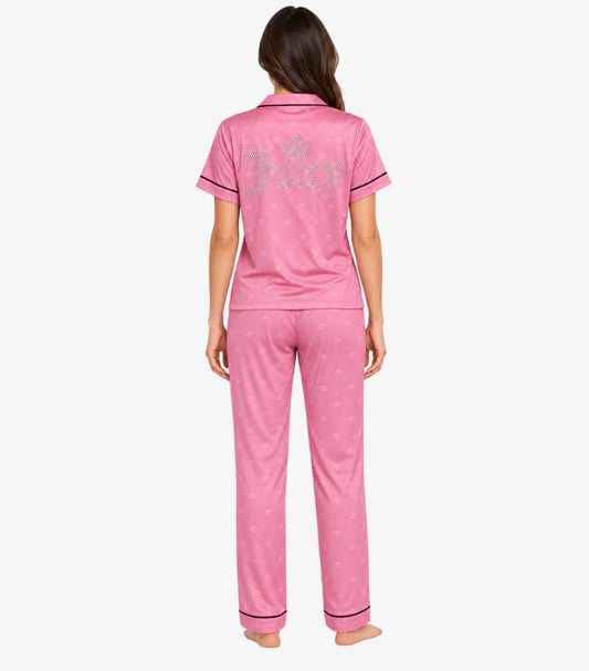 Juicy Couture pink pajama set back view showing rhinestone Juicy gothic script and crown logo on top with navy piping trim