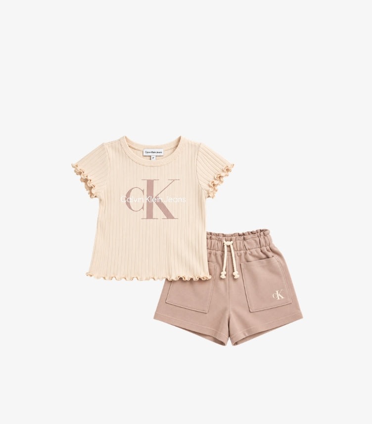 Calvin Klein Jeans girls' two-piece outfit featuring cream ribbed CK logo T-shirt with ruffle sleeves and beige drawstring shorts with patch pockets.