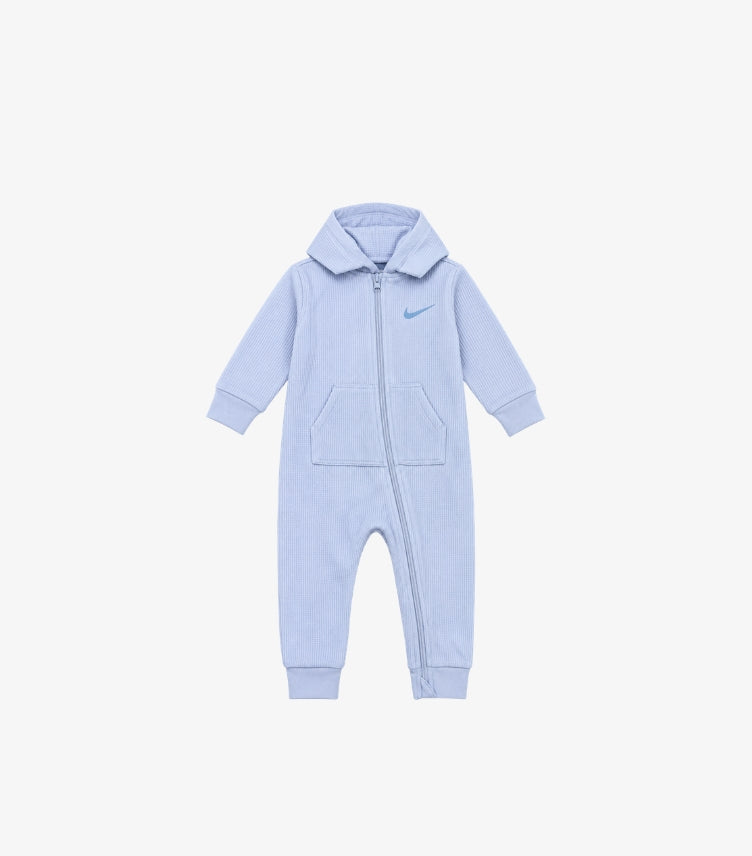 Nike baby light blue ribbed hooded romper featuring signature Swoosh logo, full-length zip closure, front pockets and long sleeves.