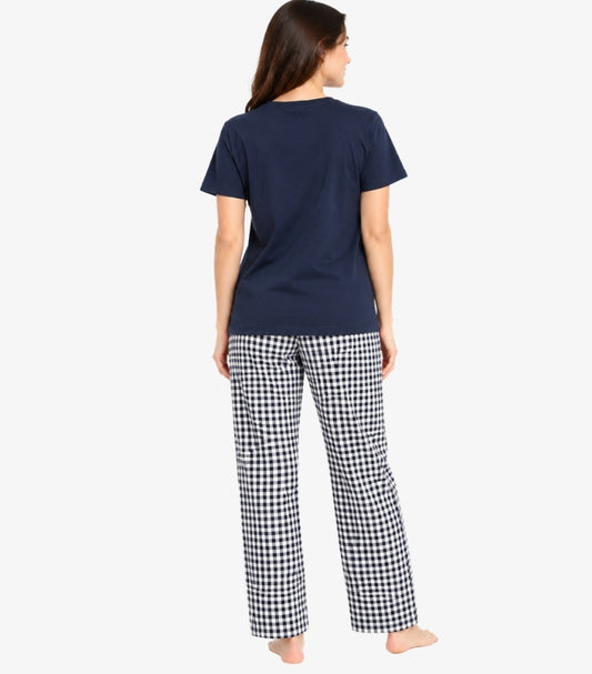 Back view of a model wearing a Marks & Spencer women’s short-sleeved pyjama top with check-pattern straight-leg bottoms