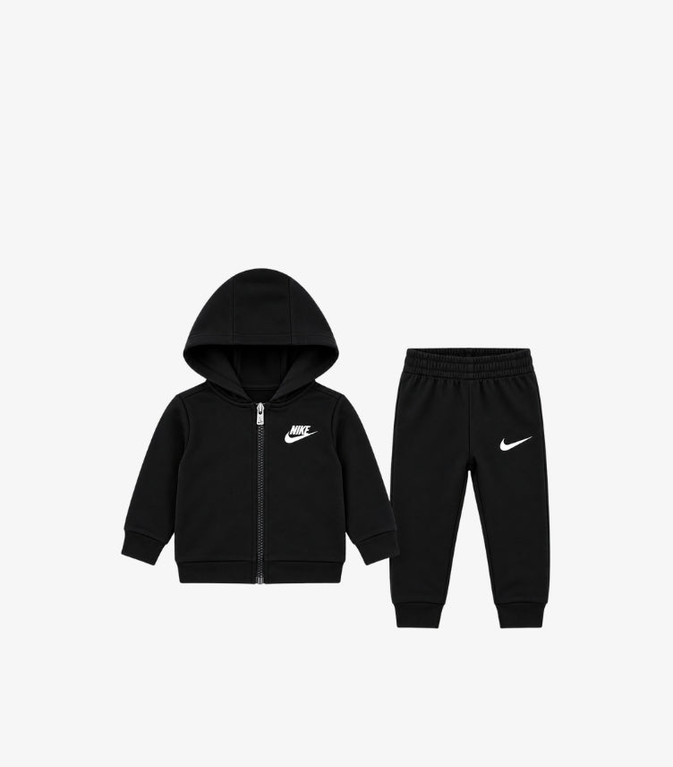 Nike baby boys zip-up hoodie and joggers tracksuit set featuring Swoosh logo, full-front zipper, hood, elasticated waistband and ribbed cuffs.