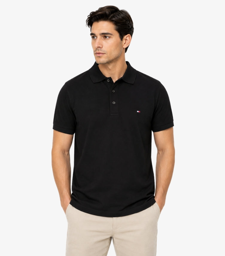 Tommy Hilfiger Men's Classic Black Pique Polo Shirt with Embroidered Flag Logo on Left Chest, 3-Button Placket and Polo Collar – Front View