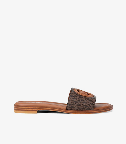 Michael Kors Carissa Brown MK Signature Logo Canvas Slide Sandal – Side Profile View Showing Flat Rubber Sole and Open Toe