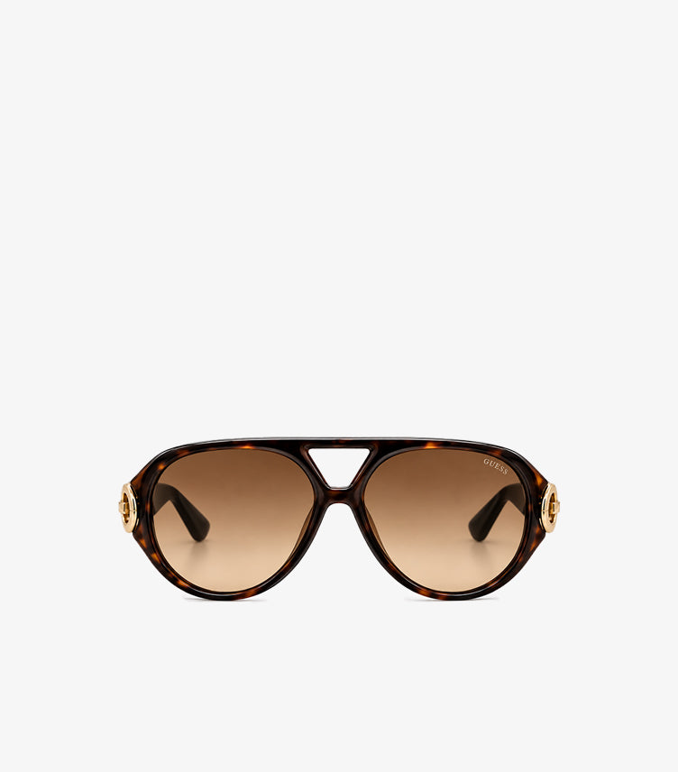 Front view of Guess women’s oversized tortoiseshell aviator sunglasses with brown gradient lenses and gold-tone G logo accents