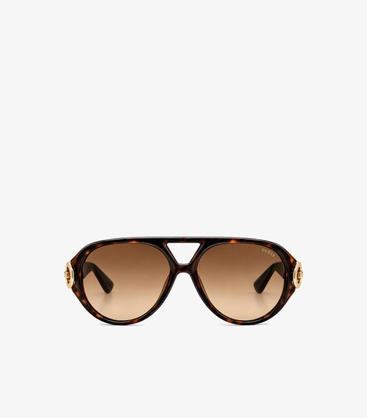 Front view of Guess women’s oversized tortoiseshell aviator sunglasses with brown gradient lenses and gold-tone G logo accents