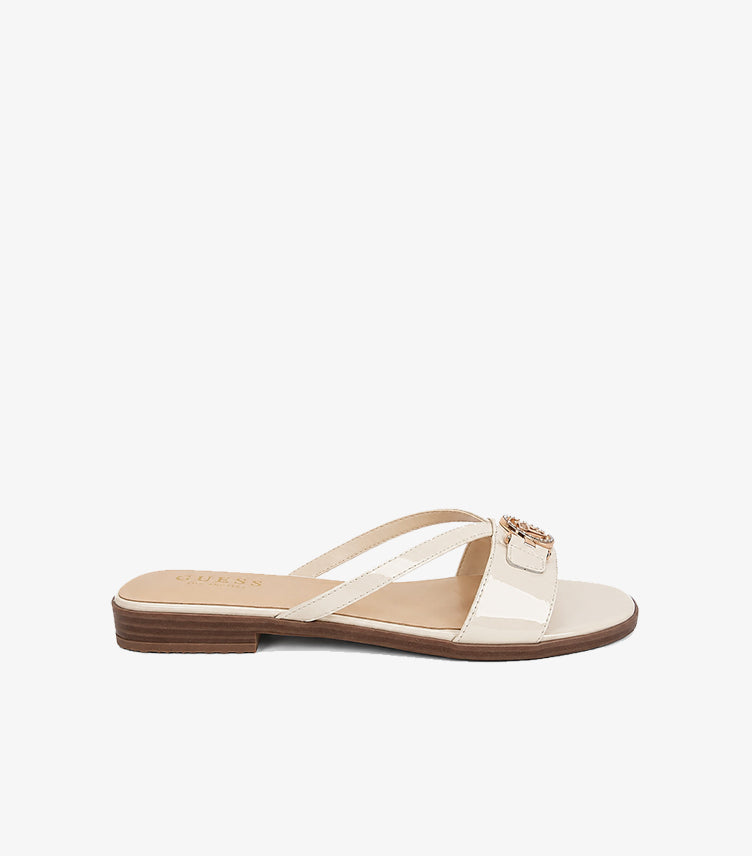 GUESS Los Angeles cream patent leather slide sandal side profile showing low wood-effect block heel and cross-strap construction