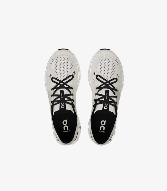 Top view of On Running Cloud X lace-up trainers showing breathable perforated uppers and branded insoles