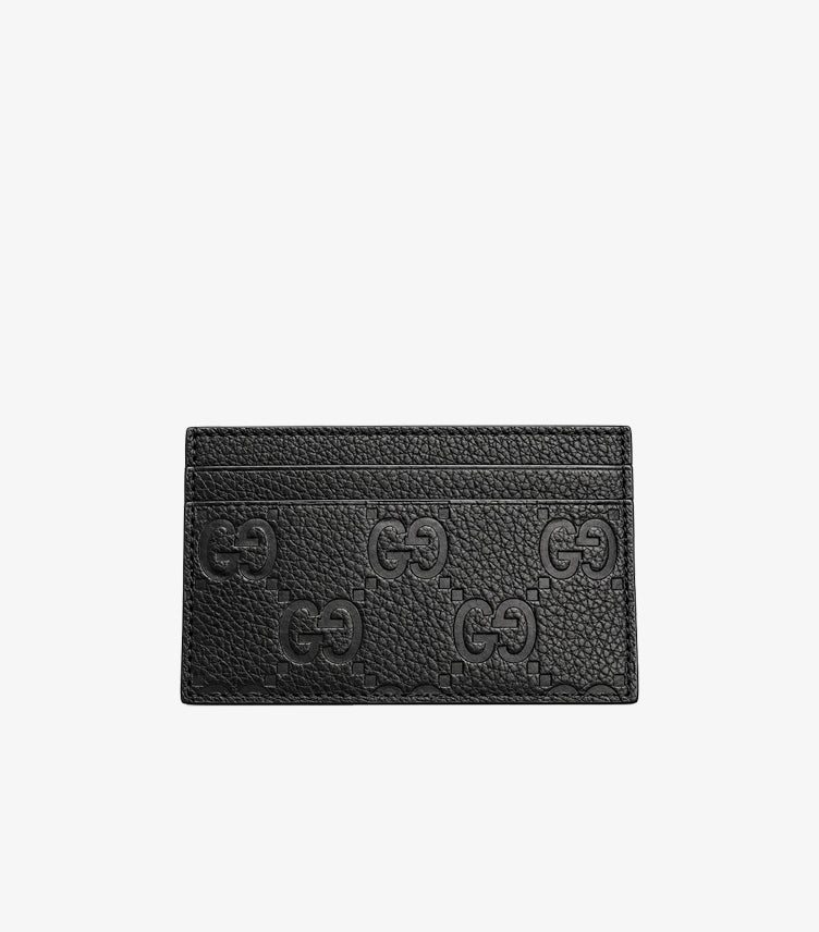 Gucci GG embossed leather card holder featuring signature monogram pattern and multiple card slots