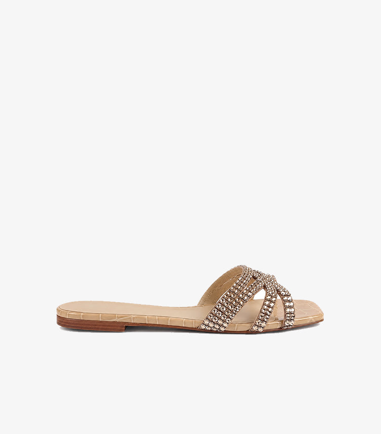 Side profile of GINA beige crystal embellished flat sandals