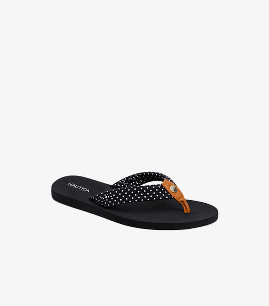 Angled view of Nautica women’s black polka dot flip-flop sandal with branded footbed and logo emblem