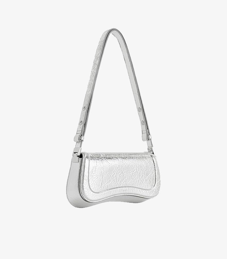 JW PEI Gabbi Silver Metallic Crinkle Leather Curved Saddle Shoulder Bag with Silver Buckle Hardware – Angled Side View