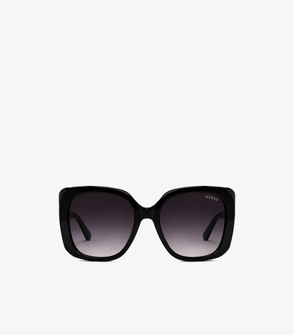 Guess women's oversized square sunglasses with glossy frame and gradient UV protection lenses, front view.