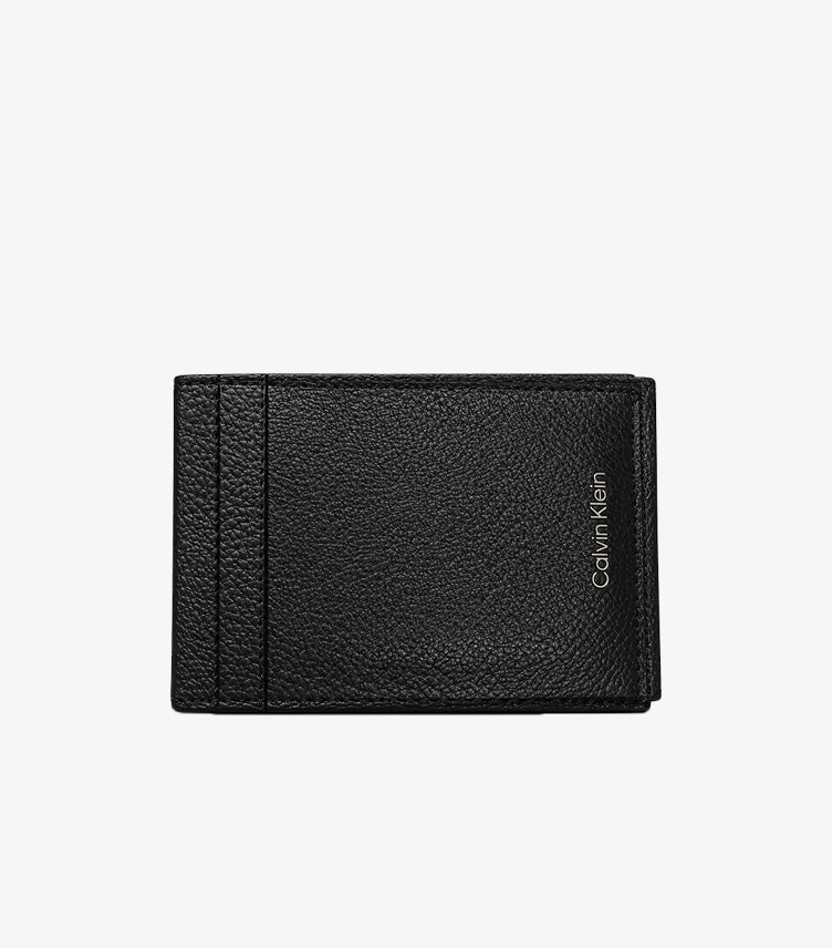 Front view of Calvin Klein black pebbled leather bifold card holder with vertical logo detail