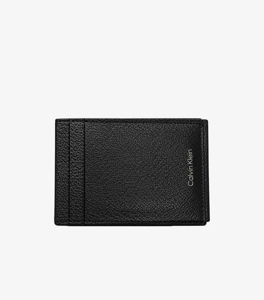 Front view of Calvin Klein black pebbled leather bifold card holder with vertical logo detail