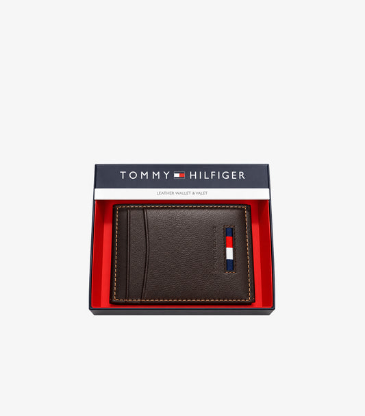 Tommy Hilfiger brown leather bifold card holder with flag logo displayed in branded gift box