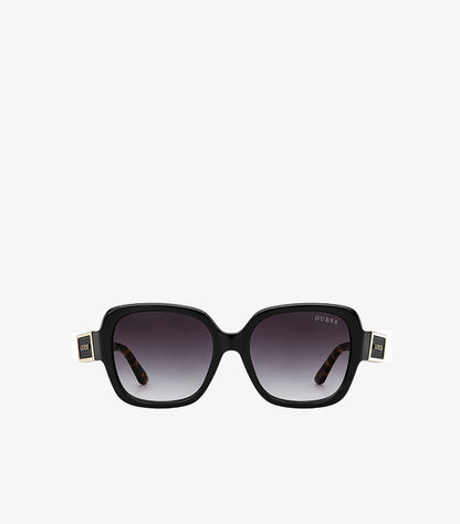 Front view of Guess black square sunglasses featuring dark gradient lenses and gold-tone temple logos