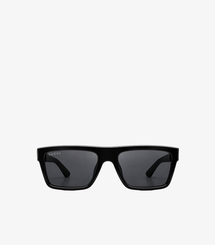 Front view of Gucci black rectangular sunglasses with dark tinted lenses and a structured full-rim frame