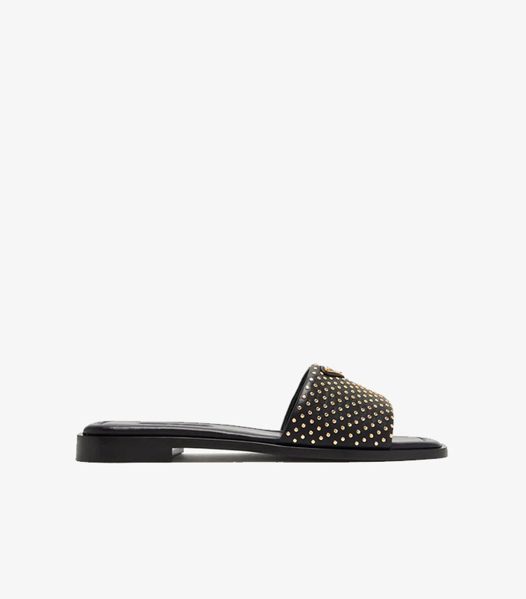 Prada black gold micro-stud leather flat slide sandal clean side profile view with triangle logo