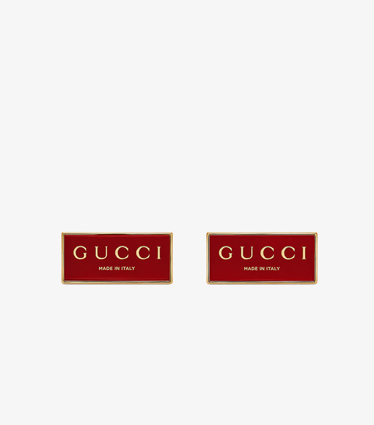 Gucci Made in Italy red enamel rectangular cufflinks pair front view showing gold lettering and border