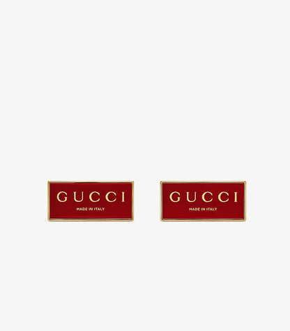 Gucci Made in Italy red enamel rectangular cufflinks pair front view showing gold lettering and border