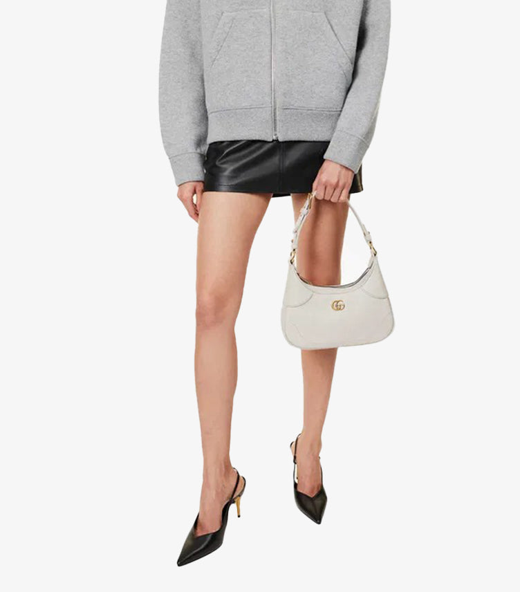 Model wearing Gucci Aphrodite Small white leather shoulder bag crossbody