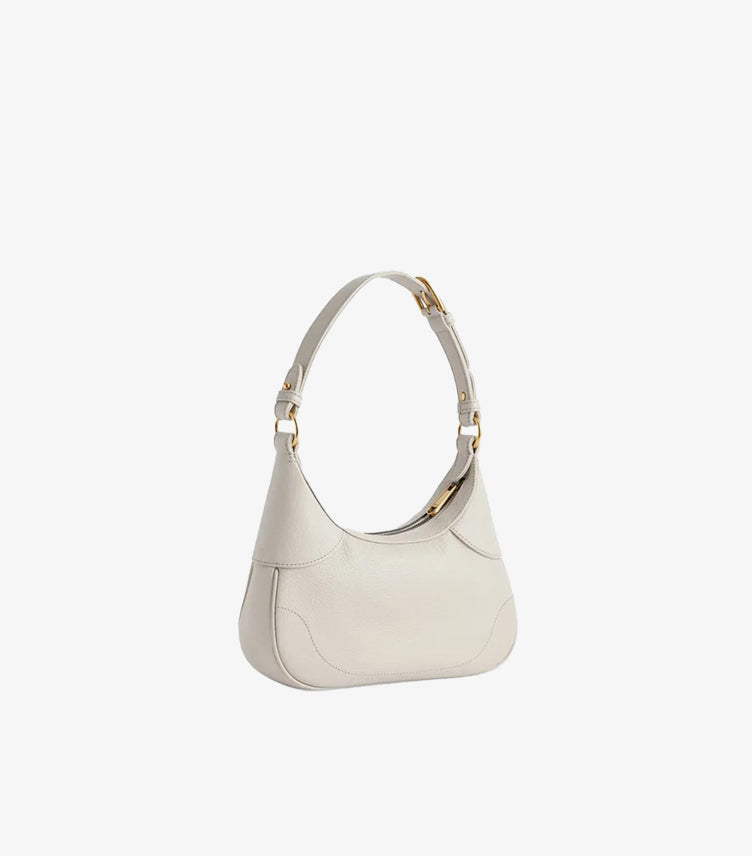 Gucci Aphrodite white leather bag side profile showing curved wave base and adjustable strap