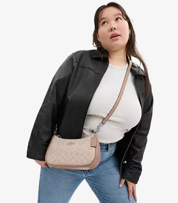 Female Model Wearing Coach Teri Shoulder Bag in Signature Canvas