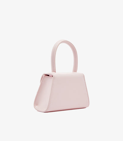 Self-Portrait pink structured mini trapeze bag side profile view showing top handle and clean silhouette
