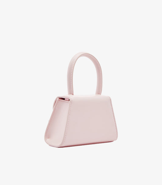 Self-Portrait pink structured mini trapeze bag side profile view showing top handle and clean silhouette