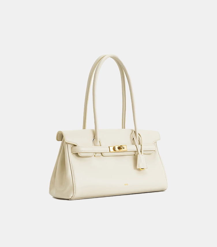 JW PEI ivory top handle bag angled view showing structured silhouette and gold-tone zip closure