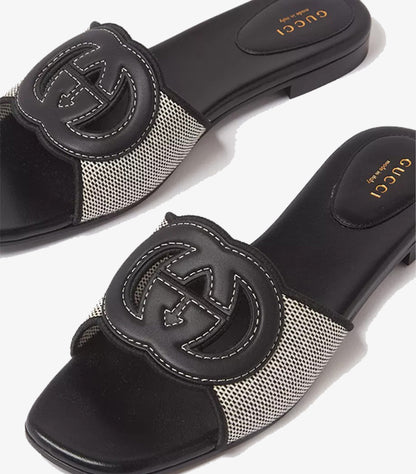 Gucci Interlocking G flat slides top view showing GG leather logo and GUCCI Made in Italy insole