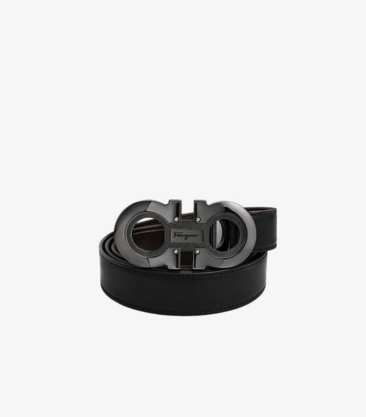 Salvatore Ferragamo Gancini reversible black leather belt gunmetal buckle coiled view