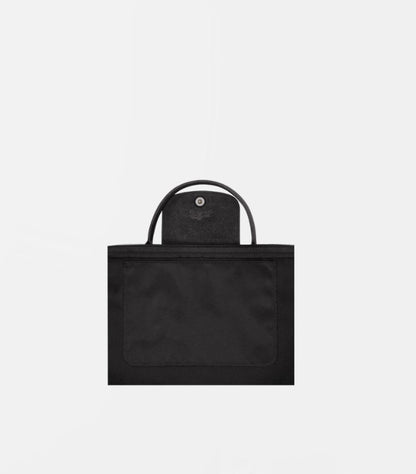 Close-up of Longchamp Le Pliage Energy Large handbag exterior pocket, handles and snap-fastened flap