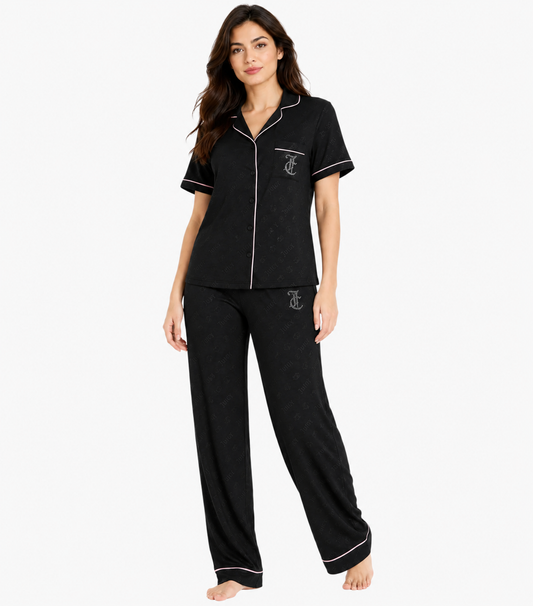 Juicy Couture black pajama set front view showing tonal print notch collar white piping and rhinestone JC monogram 