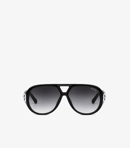 Front view of Guess women’s oversized black aviator sunglasses with grey gradient lenses and silver-tone G logo accents