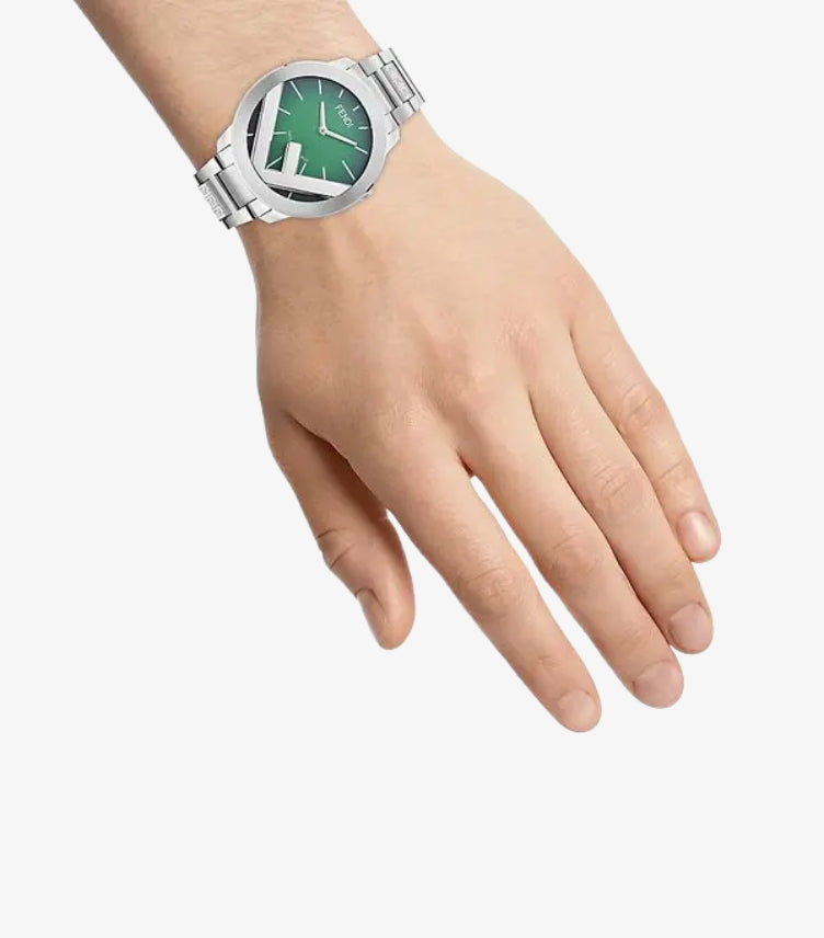 Fendi silver-tone bracelet watch worn on the wrist with green dial and oversized FF motif