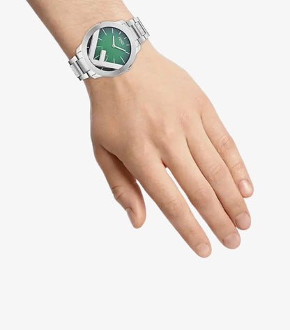Fendi silver-tone bracelet watch worn on the wrist with green dial and oversized FF motif
