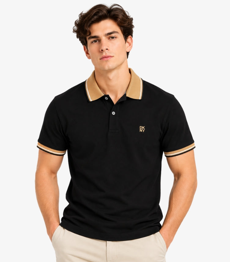 Man wearing a DKNY black short-sleeve polo shirt with a tan contrast collar, striped cuffs and small chest logo