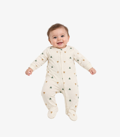 Baby wearing a cream GAP footed sleepsuit with long sleeves, front zip and green and brown bear print
