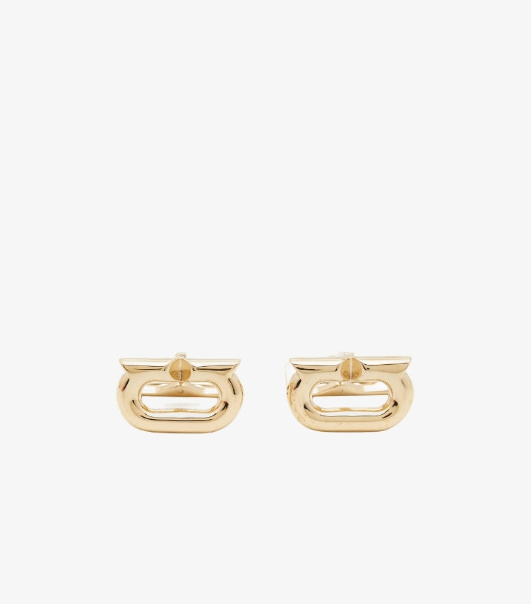 Front view of Ferragamo Gancini cufflinks featuring polished gold-tone open-centre logo designs