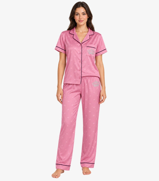 Juicy Couture pink pajama set front view showing mandarin collar button-down top with chest pocket crown logo and matching pants