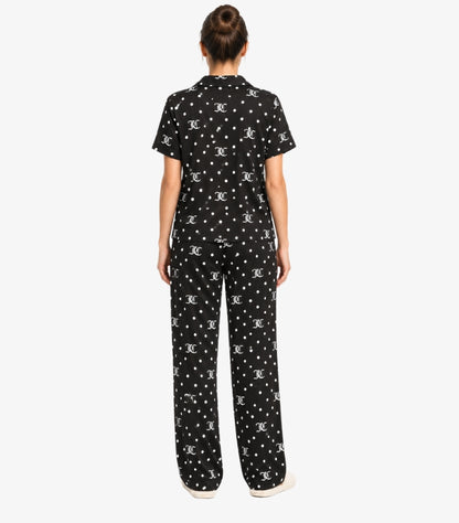 Back view of Juicy Couture women’s black pajama set with white JC monogram and polka-dot print